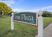 Thumbnail 25 of 39 - A sign that says Lynn Plaza stands in a grassy area.