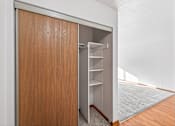 Thumbnail 11 of 39 - A brown door with a shelf underneath it.