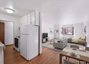 Thumbnail 14 of 39 - A modern kitchen with white appliances and a dining table.