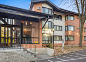 Thumbnail 10 of 58 - the facade of a new apartment building with glass doors and a staircase