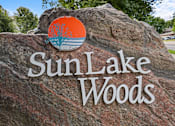 Thumbnail 3 of 59 - a rock with the sun lake woods logo on it