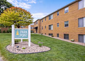 Thumbnail 29 of 36 - A sign that says Park Point stands in front of a brick building.