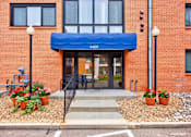 Thumbnail 35 of 58 - The entrance to a building with a blue awning and a sign that reads 4400.