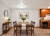 Thumbnail 55 of 58 - A dining room with a table set for a meal.