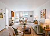 Thumbnail 47 of 58 - A living room with a couch, chairs, and a coffee table.