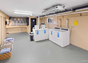 Thumbnail 4 of 36 - A room with two large white machines and a basket of towels on the left.