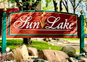 Thumbnail 56 of 59 - A sign that says Sun Lake in front of some trees.