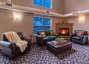 Thumbnail 19 of 59 - A cozy living room with a fireplace and comfortable seating.