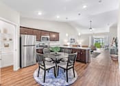 Thumbnail 9 of 16 - Omaha Wenninghoff Road Nebraska Apartment Rentals Redwood Living Redwood Omaha Wenninghoff Roade Forestwood Kitchen to Den