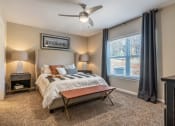 Thumbnail 6 of 11 - a bedroom with a bed and a ceiling fan