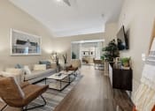 Thumbnail 5 of 11 - a living room with a couch and a tv