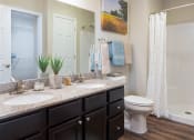 Thumbnail 9 of 9 - a bathroom with two sinks and a toilet