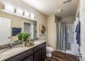 Thumbnail 10 of 10 - a bathroom with two sinks and a shower and a toilet