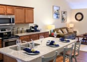 Thumbnail 6 of 10 - Brownstown MI Apartment Rentals Redwood Peninsula Ridge Kitchen Island