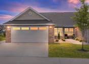 Thumbnail 4 of 12 - Greenwood Indiana Apartment Rentals Redwood Living Redwood Greenwood Exterior at Dusk