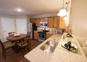 Thumbnail 3 of 9 - Lake Orion Michigan Apartment Rentals Redwood Lake Orion Kitchen with Granite and Stainless