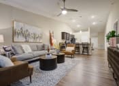Thumbnail 5 of 10 - a living room with a couch and a table
