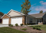 Thumbnail 2 of 9 - Noblesville IN Apartment Rentals Redwood Noblesville Harewood Drive Main Exterior Garage
