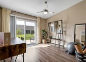 Thumbnail 10 of 11 - a living room with a mirror and a sliding glass door
