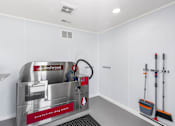Thumbnail 18 of 20 - A redwood dog wash machine is in a white room.