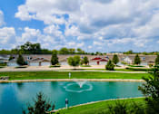 Thumbnail 14 of 21 - A heart-shaped pattern is created in the middle of a lake.