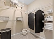 Thumbnail 15 of 18 - A laundry room with clothes hanging on a clothesline.