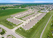 Thumbnail 4 of 19 - A large housing development with a mix of detached and semi-detached homes.