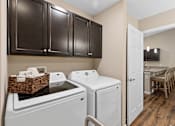 Thumbnail 14 of 19 - A kitchen with a white dishwasher and a white oven.