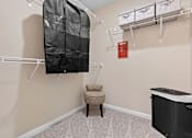 Thumbnail 5 of 19 - A baby room with a crib and a chair.
