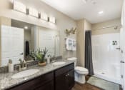 Thumbnail 10 of 10 - a bathroom with two sinks and a shower and a toilet