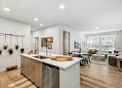 Thumbnail 17 of 33 - the preserve at ballantyne commons apartments clubhouse with kitchen and living room