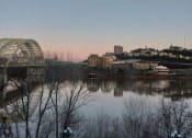 Thumbnail 12 of 12 - a bridge over a river with a city in the background
