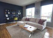 Thumbnail 5 of 12 - a living room with a couch and a coffee table