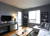 Thumbnail 4 of 12 - a living room with a couch and a tv