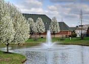 Thumbnail 10 of 17 - A fountain in the middle of a pond surrounded by trees. at Twin Fountains Apartments, Ohio, 45040