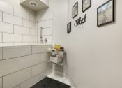 Thumbnail 12 of 63 - a bathroom with a shower and a sink in it at Vanguard Crossing, St. Louis