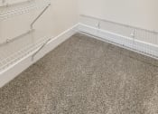 Thumbnail 57 of 63 - an empty closet with empty shelves in a room with carpet and white walls at Vanguard Crossing, St. Louis, MO 63124