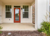 Thumbnail 52 of 63 - the entrance to a house with a red door at Vanguard Crossing, Missouri