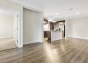 Thumbnail 41 of 63 - an empty room with white walls and a wood floor at Vanguard Crossing, St. Louis, 63124