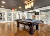 Thumbnail 14 of 63 - a game room with a pool table and a tv at Vanguard Crossing, St. Louis, MO 63124