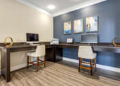 Thumbnail 13 of 63 - a office with two chairs and a desk with a computer at Vanguard Crossing, St. Louis, 63124