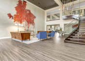 Thumbnail 33 of 63 - the lobby of a building with a lobby area and stairs at Vanguard Crossing, St. Louis, MO