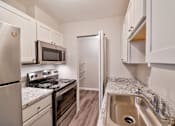 Thumbnail 1 of 58 - Chef-Inspired Kitchens Feature Stainless Steel Appliances at Glen Hills Apartments, Glendale, 53209