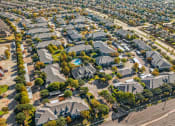 Thumbnail 49 of 51 - Neighborhood aerial view with houses and trees at Riachi at One21, Plano, TX, Texas, 75025