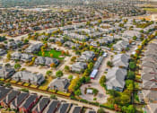 Thumbnail 50 of 51 - City aerial view with green lawn at Riachi at One21, Texas