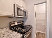 Thumbnail 15 of 58 - Electric Range In Kitchen at Glen Hills Apartments, Glendale, WI