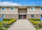 Thumbnail 48 of 58 - Courtyard Walking Path at Glen Hills Apartments, Glendale, WI