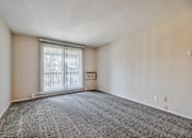 Thumbnail 25 of 58 - Large Living Room With Ceramic Tile Flooring at Glen Hills Apartments, Glendale, WI