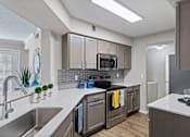 Thumbnail 5 of 44 - Efficient Appliances In Kitchen at Wellington at Willow Bend, Plano, TX