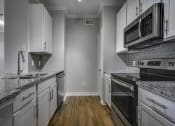 Thumbnail 13 of 51 - Fully Equipped kitchen at Riachi at One21, Plano, Texas